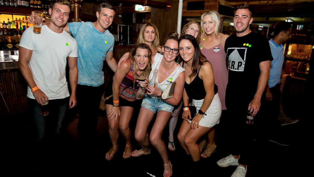 Fun group of girls and guys on pub crawl in surfers paradise