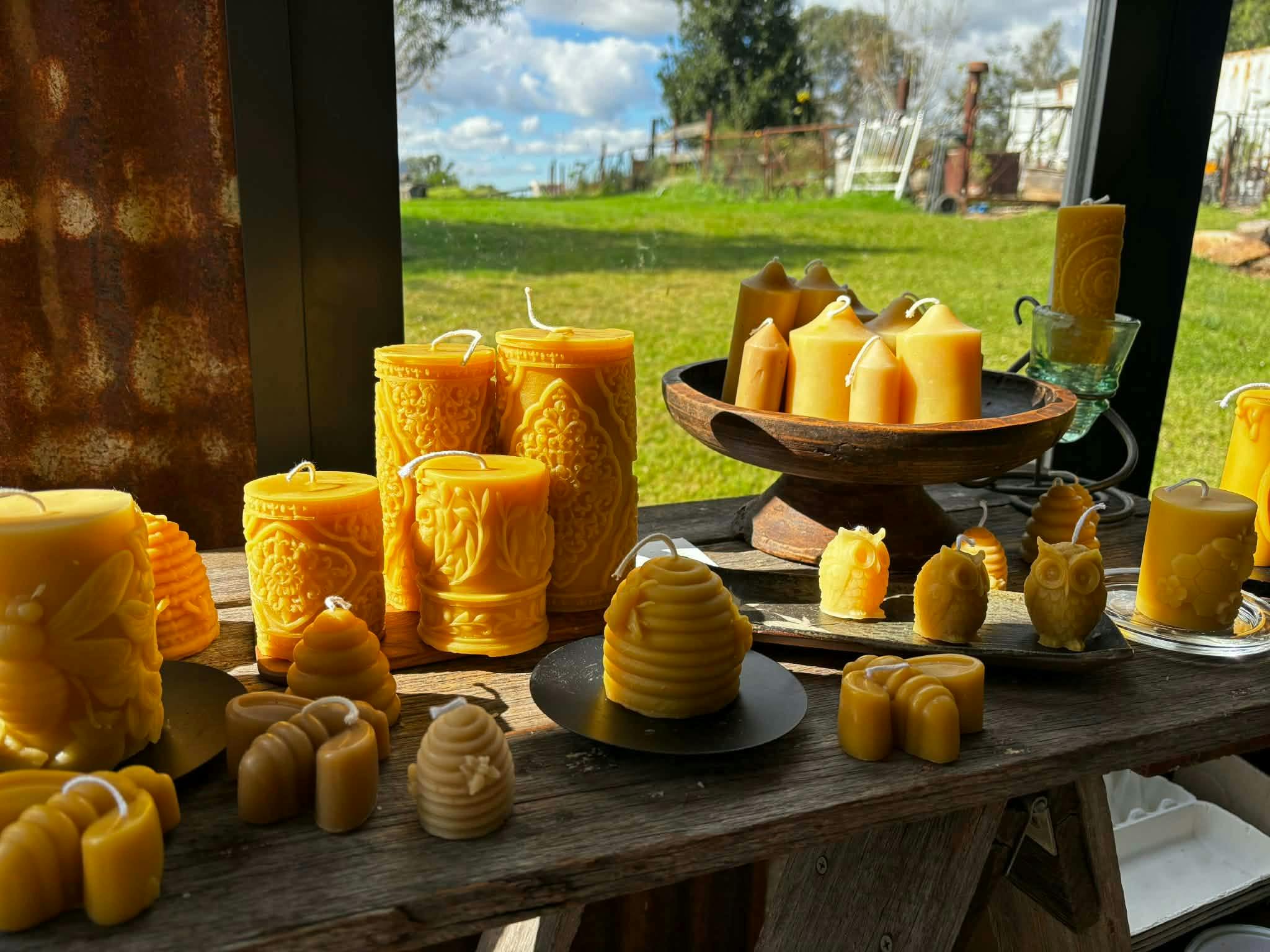 Bee wax candles in the sunlight on a farm