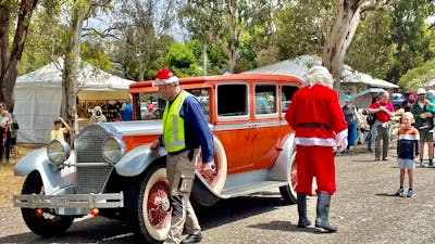 Santa and vintage classic car