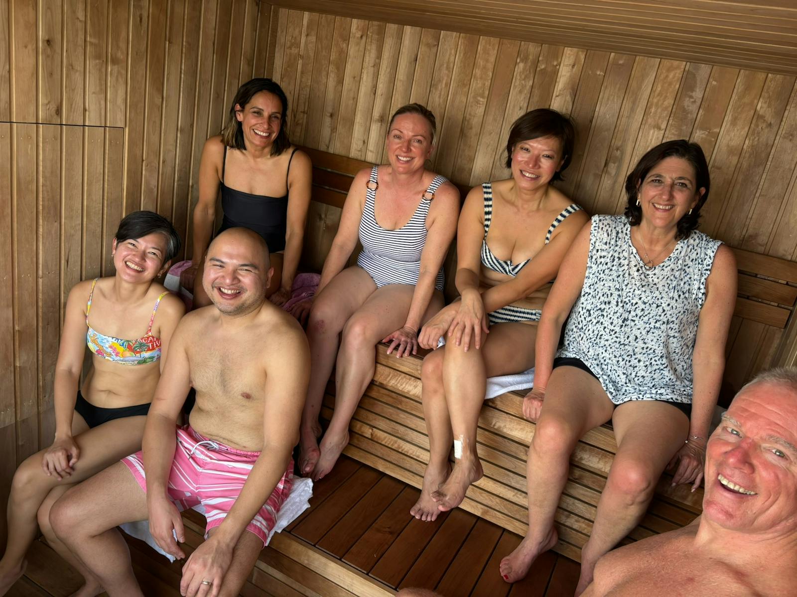 Smiling people in a sauna