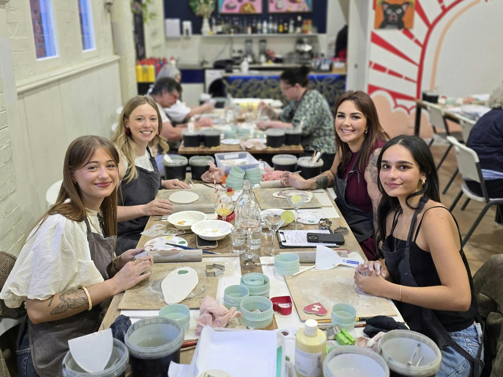 A group enjoying a pottery class
