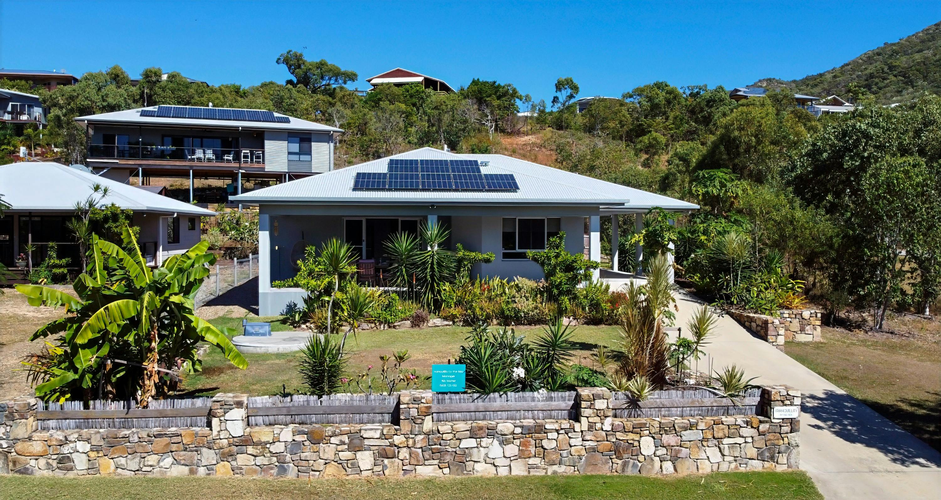 “Modern family-friendly holiday rental home opposite beach in Hideaway Bay Whitsundays Australia”