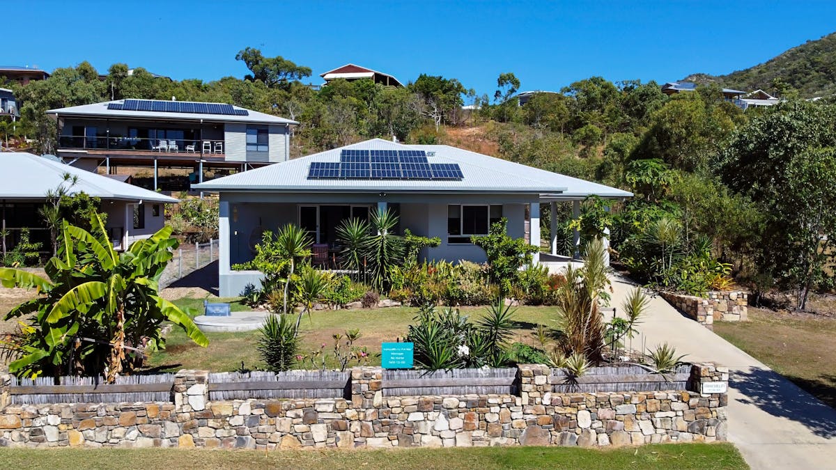 “Modern family-friendly holiday rental home opposite beach in Hideaway Bay Whitsundays Australia”