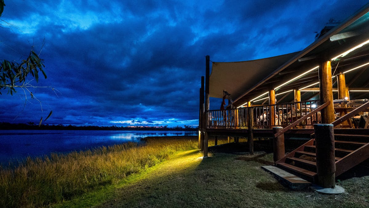 Evening view of the main deck of the lodge at twilight