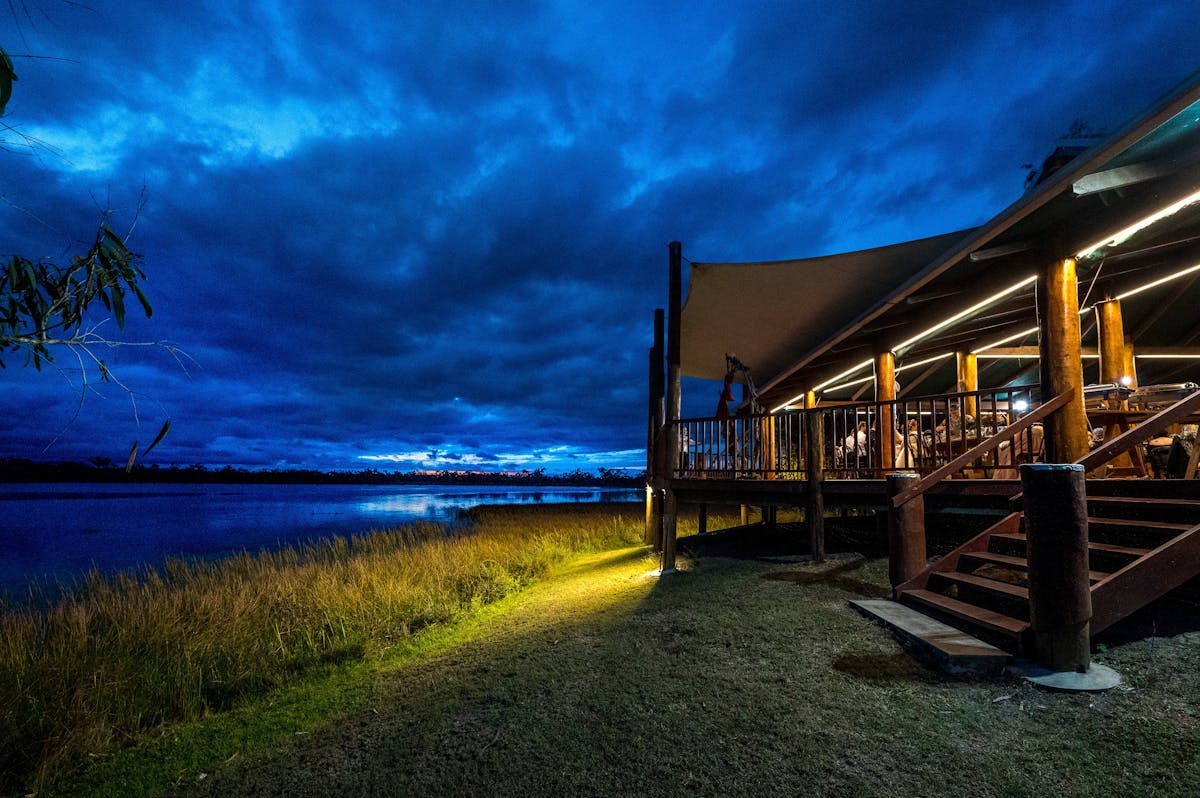 Evening view of the main deck of the lodge at twilight