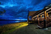 Evening view of the main deck of the lodge at twilight
