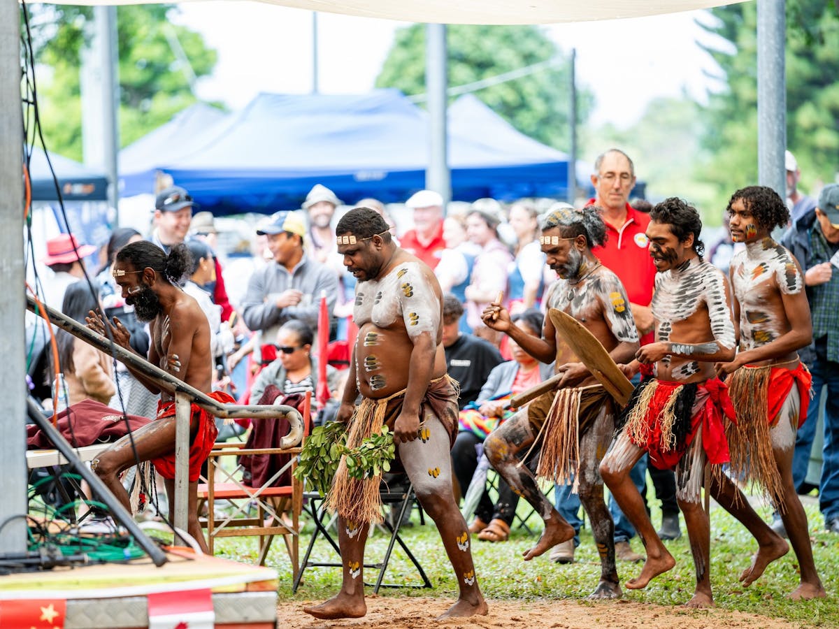 First Nation Indigenous men prepare for their performance at the Mareeba Multicultural Festival.