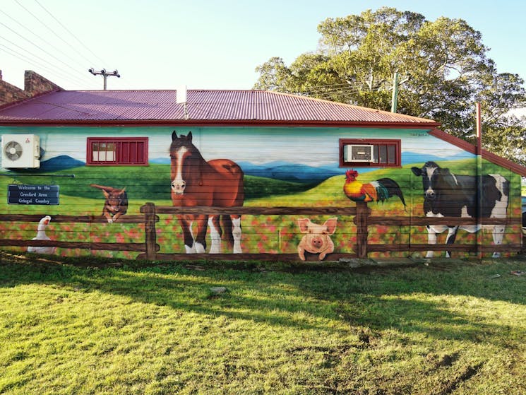 Mural of farm animals on the side of the butchers in Gresford. Painted by Dan Bianco