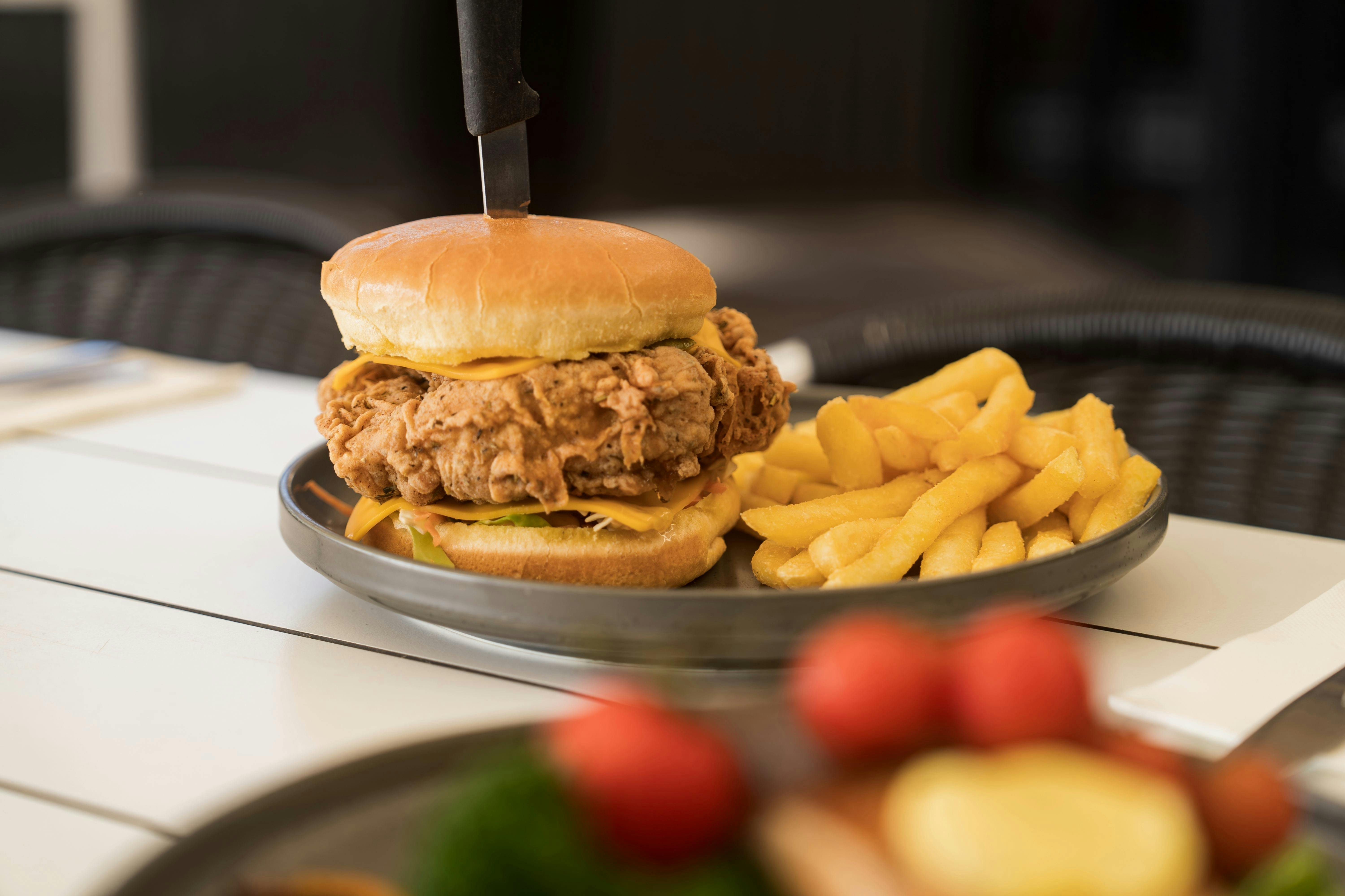 Tuck into a pub classic at The Sundowner, like a mouth-watering burger and chips!