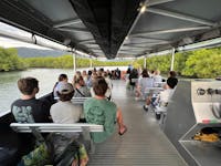 River Cruise Vessel approaching Mandingalbay Country. Mangrove, Wetland ecosystem.