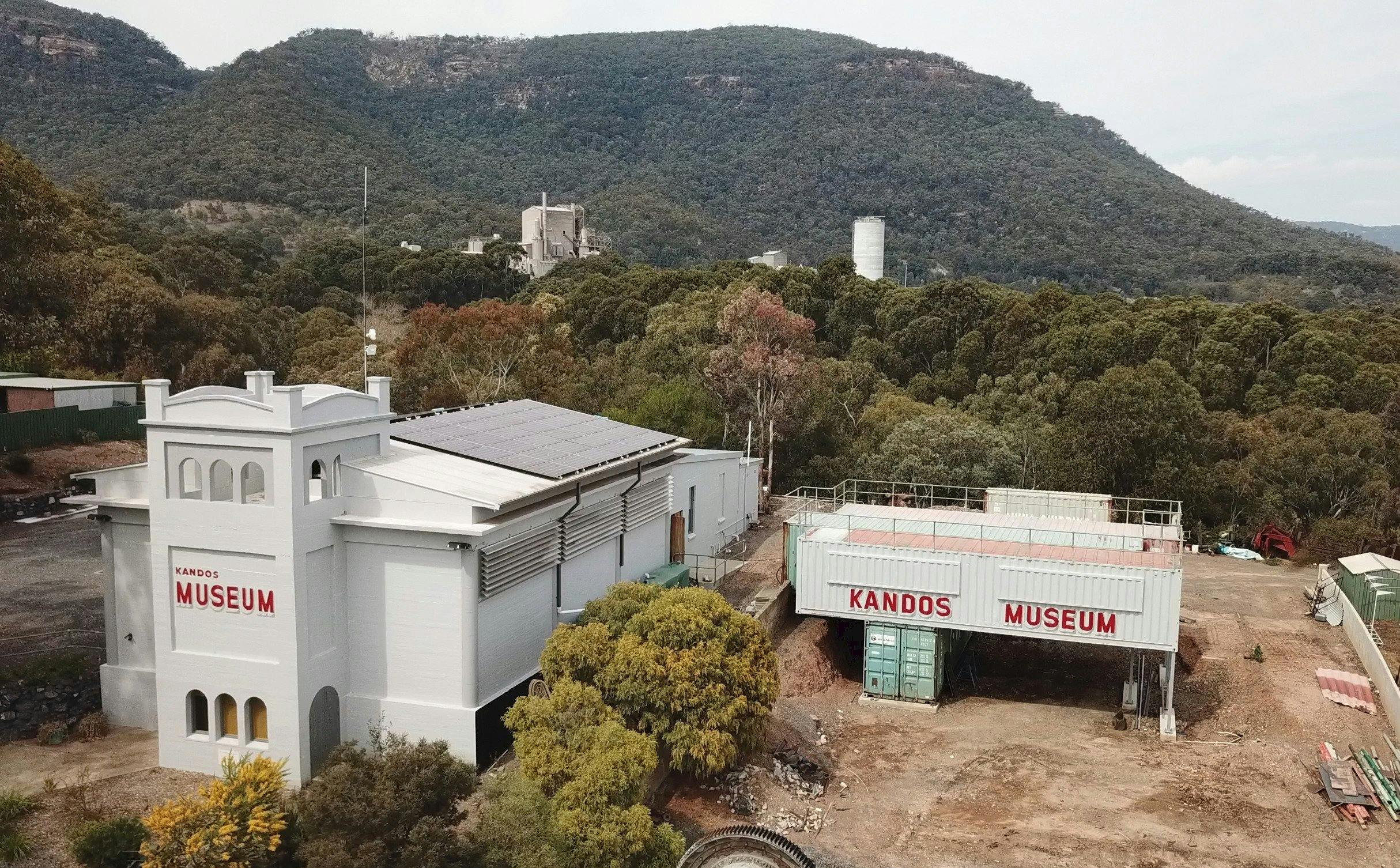Drone shot of museum with works in the background