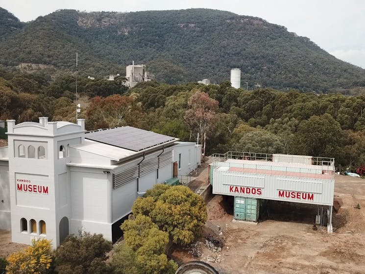 Drone shot of museum with works in the background