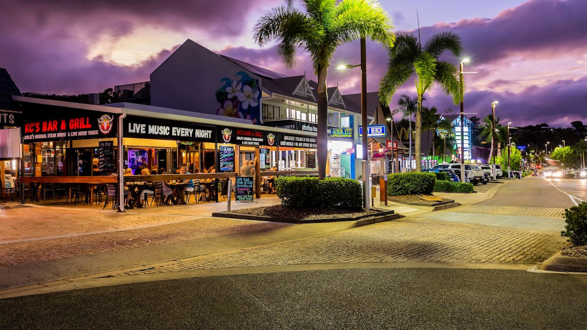 Dining along Airlie Beach main street evening time