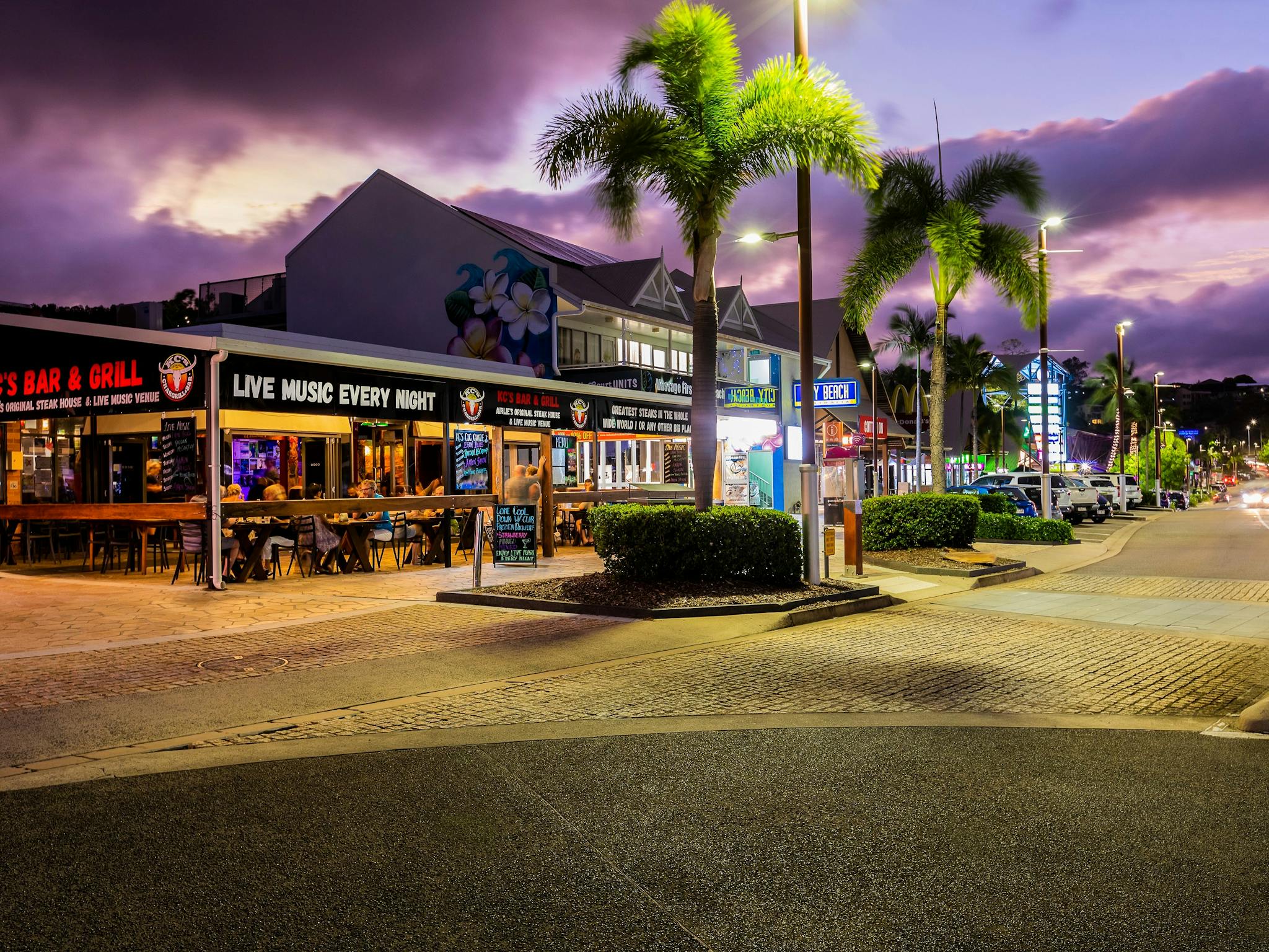 Dining along Airlie Beach main street evening time