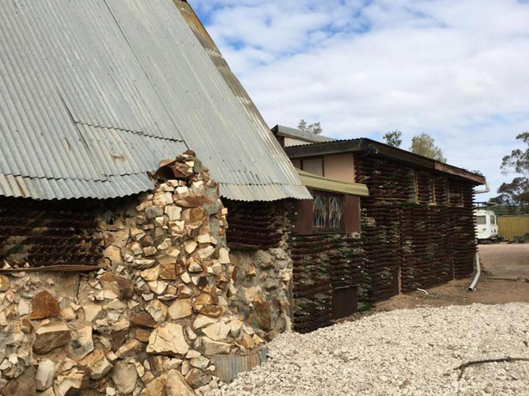 Side view of bottle house