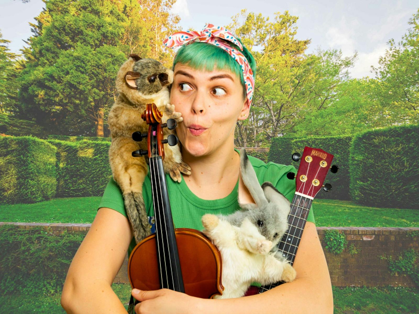 Young lady with green hair holds a musical instrument and a puppet with a garden behind her