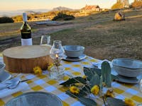 Table setting with Craig's Hut in the background.