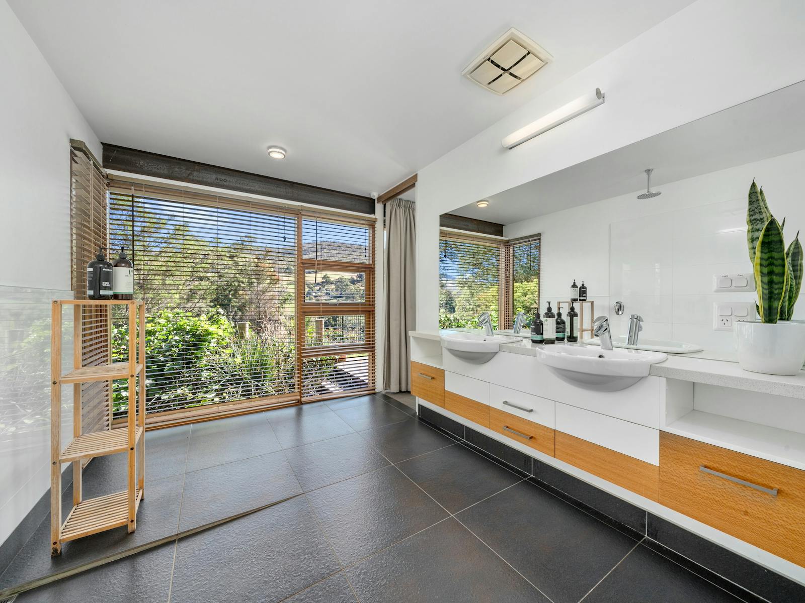 The ensuite is spacious and has an open-sided shower