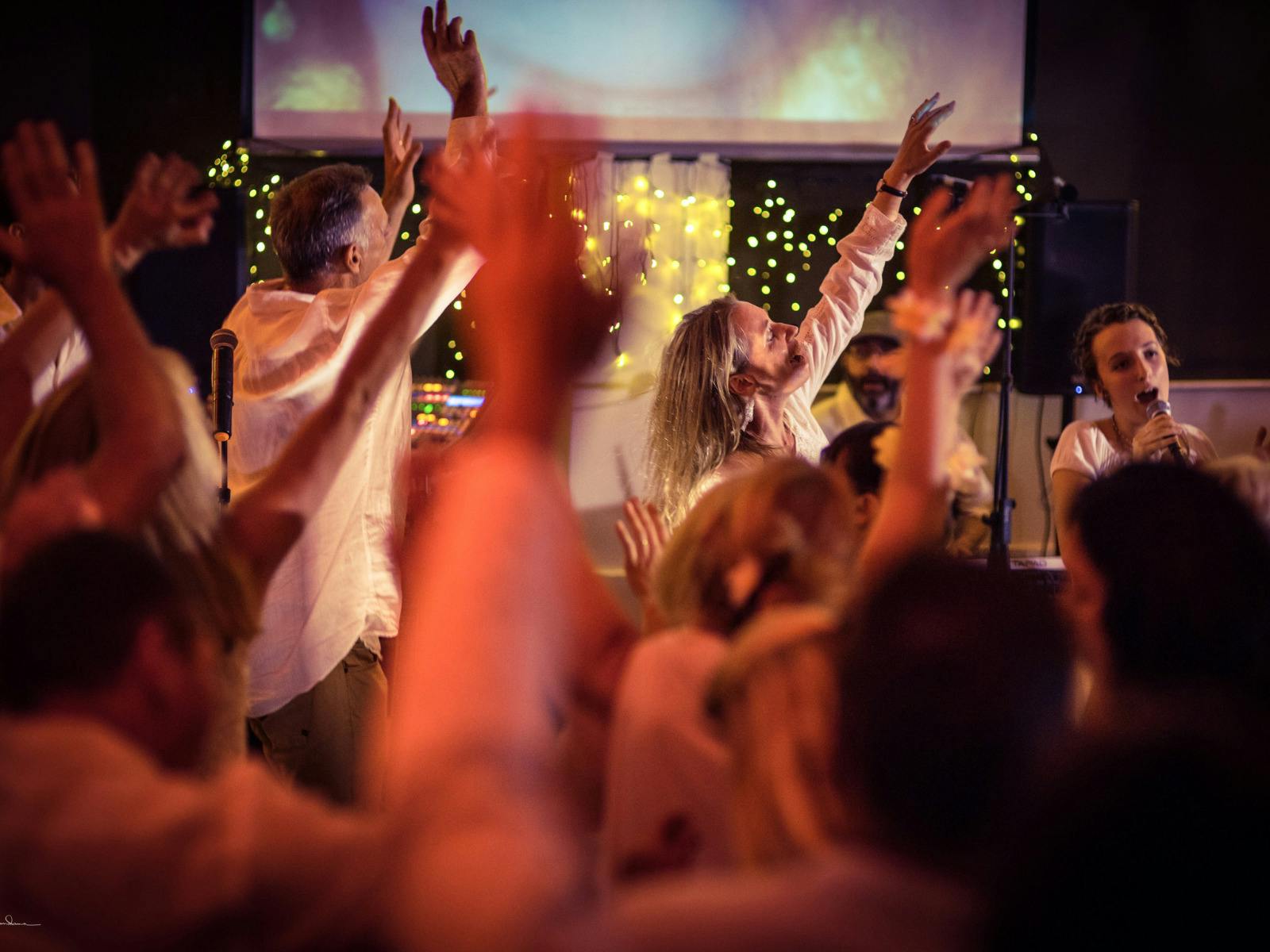 A group of people dancing to kirtan