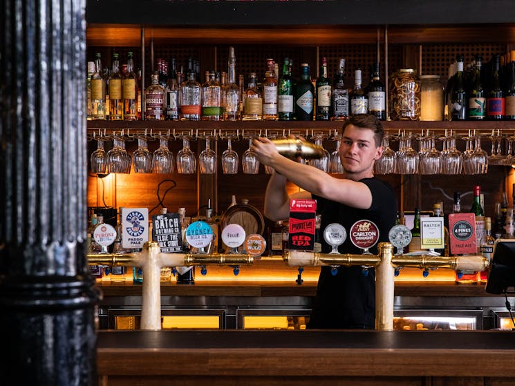 Bartender shaking cocktail