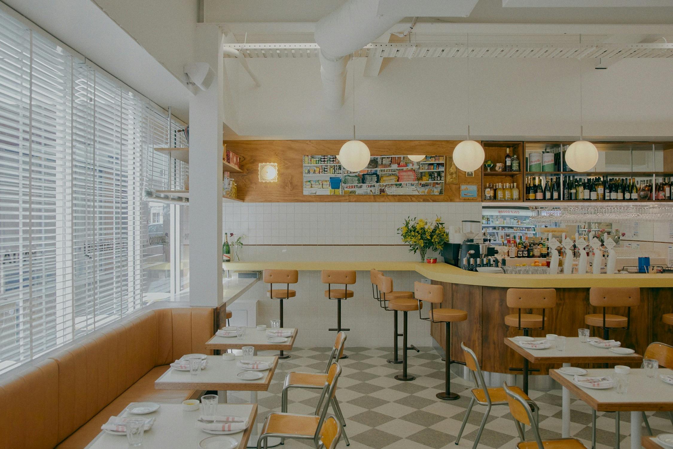inside shot of the restaurant with a retro feel and spacious booths to sit around