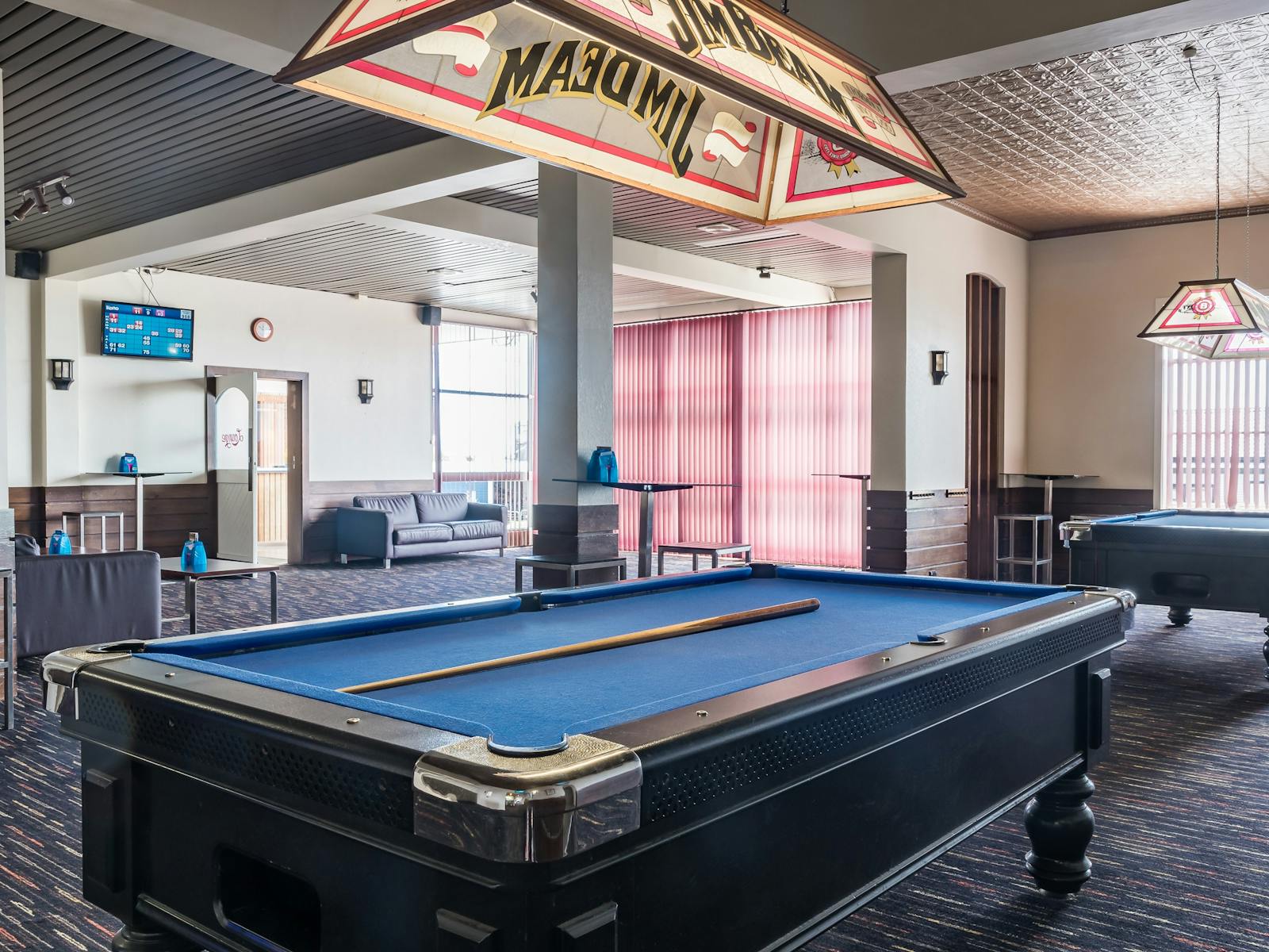 8 Ball tables in pool room and lounge