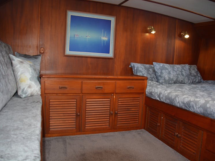 The Master stateroom has a private  en suite  bathroom, 3 portholes  and settee.