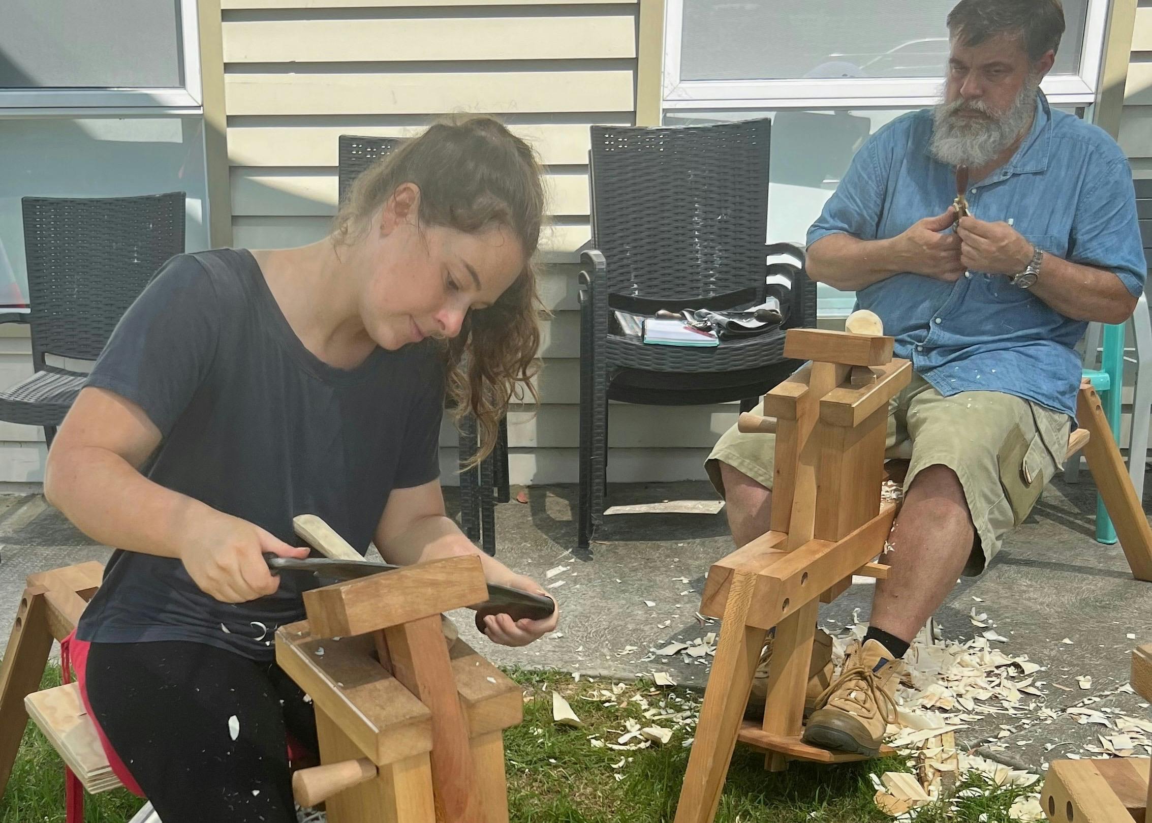 Using a shavehorse with drawknife to sculpt a spoon
