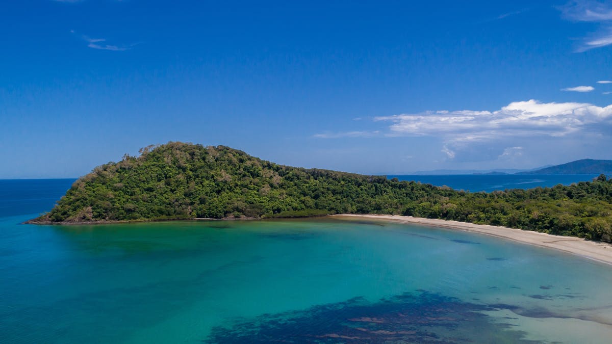 Aerial image of Cape Tribulation: beach, rainforest and reef meet.