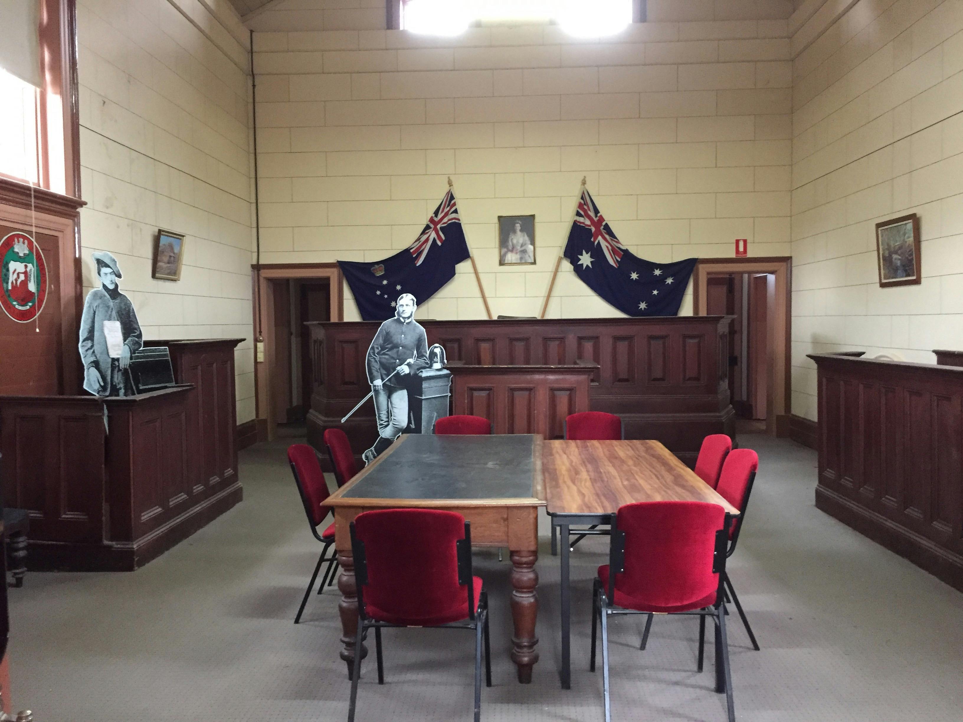 shows Victorian & Australian Flags, court furniture and cutouts of Dan Kelly & Alexander Fitzpatrick