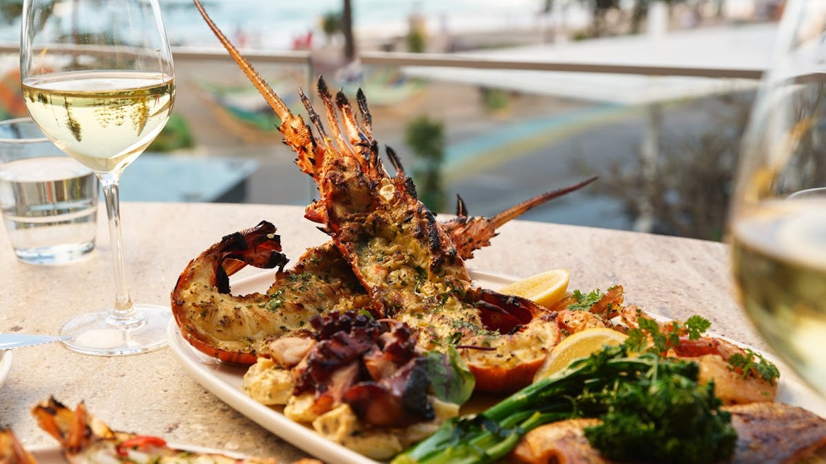 Hurricane's Surfers Paradise - Seafood Platter With A Glass of White Wine and a Beach View