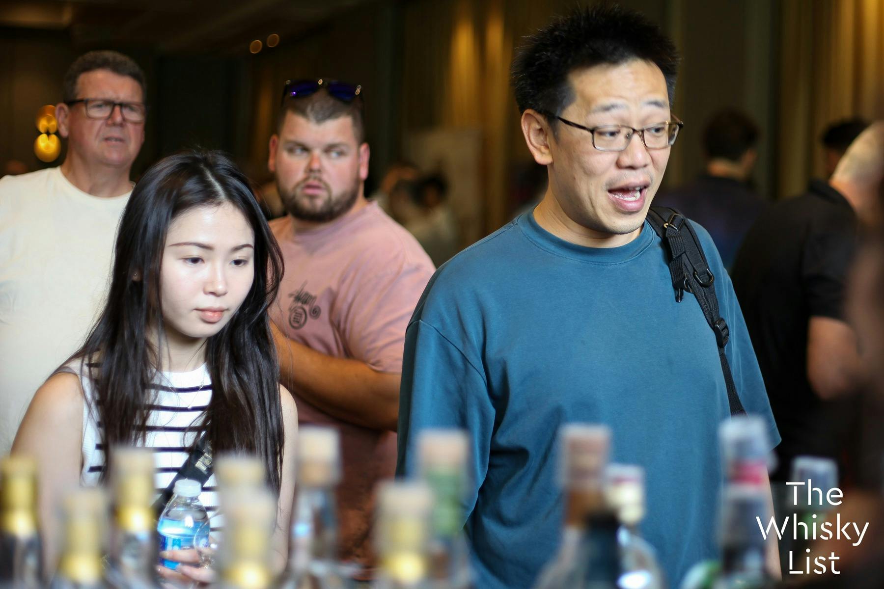 A male and female guest look at the range from an exhibitor. The man's jaw has dropped in excitement