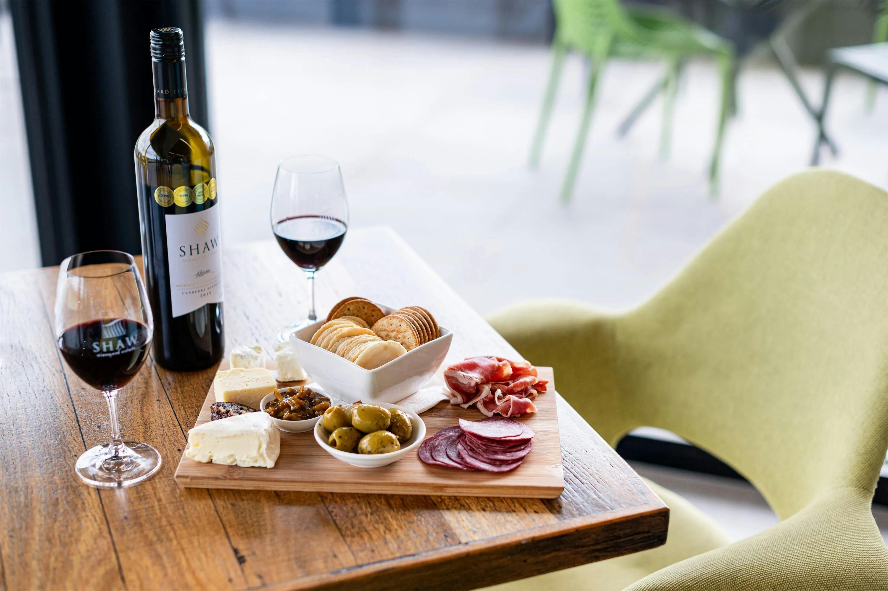 grazing platter and red wine on a table from Shaw Estate Wines Canberra
