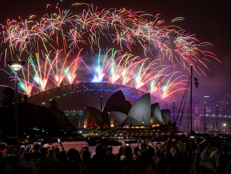 Stunning fireworks display behind the Opera House and Harbour Bridge