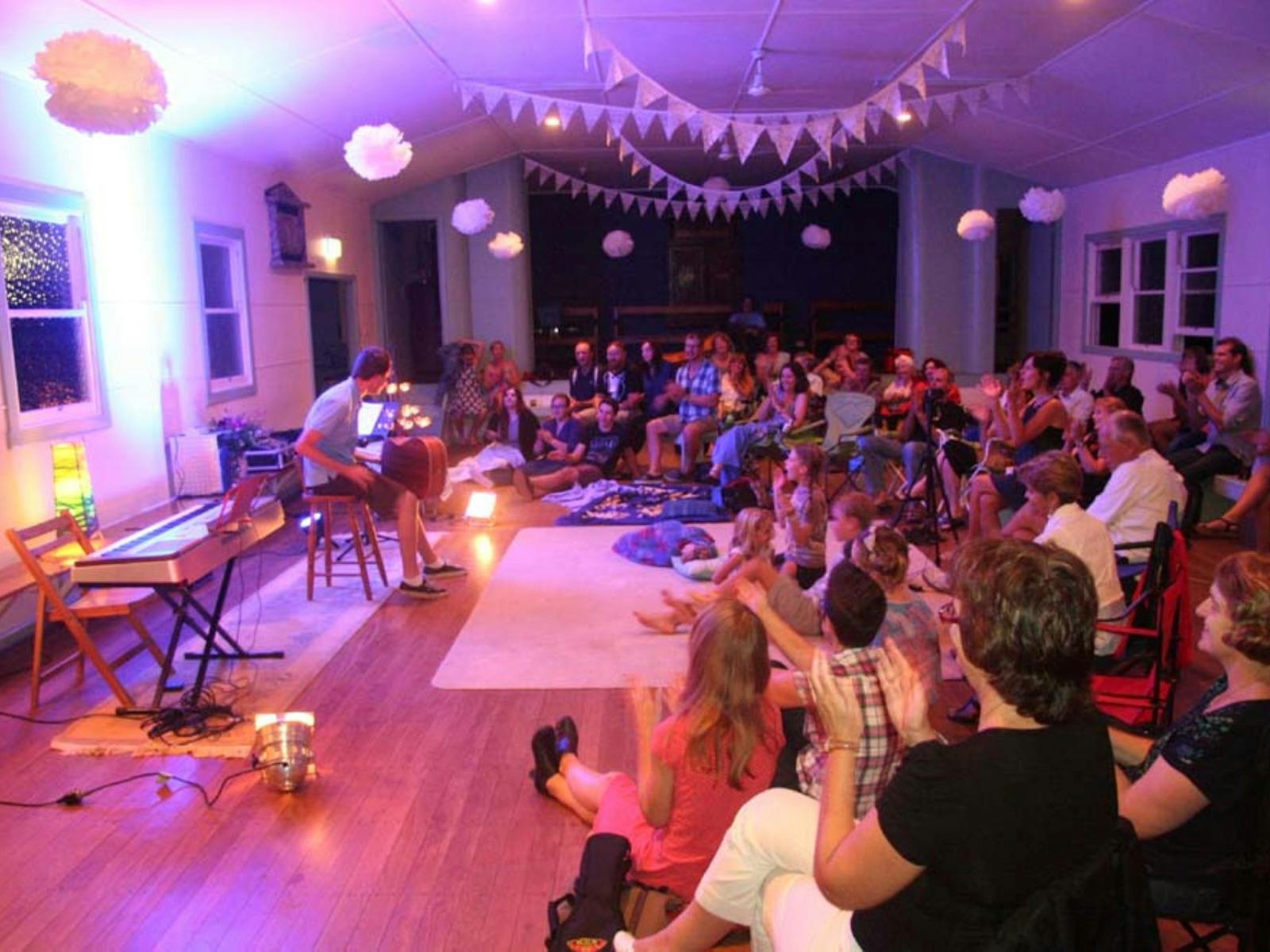 Rous Unplugged at Rous Mill Hall people playing guitar and singing