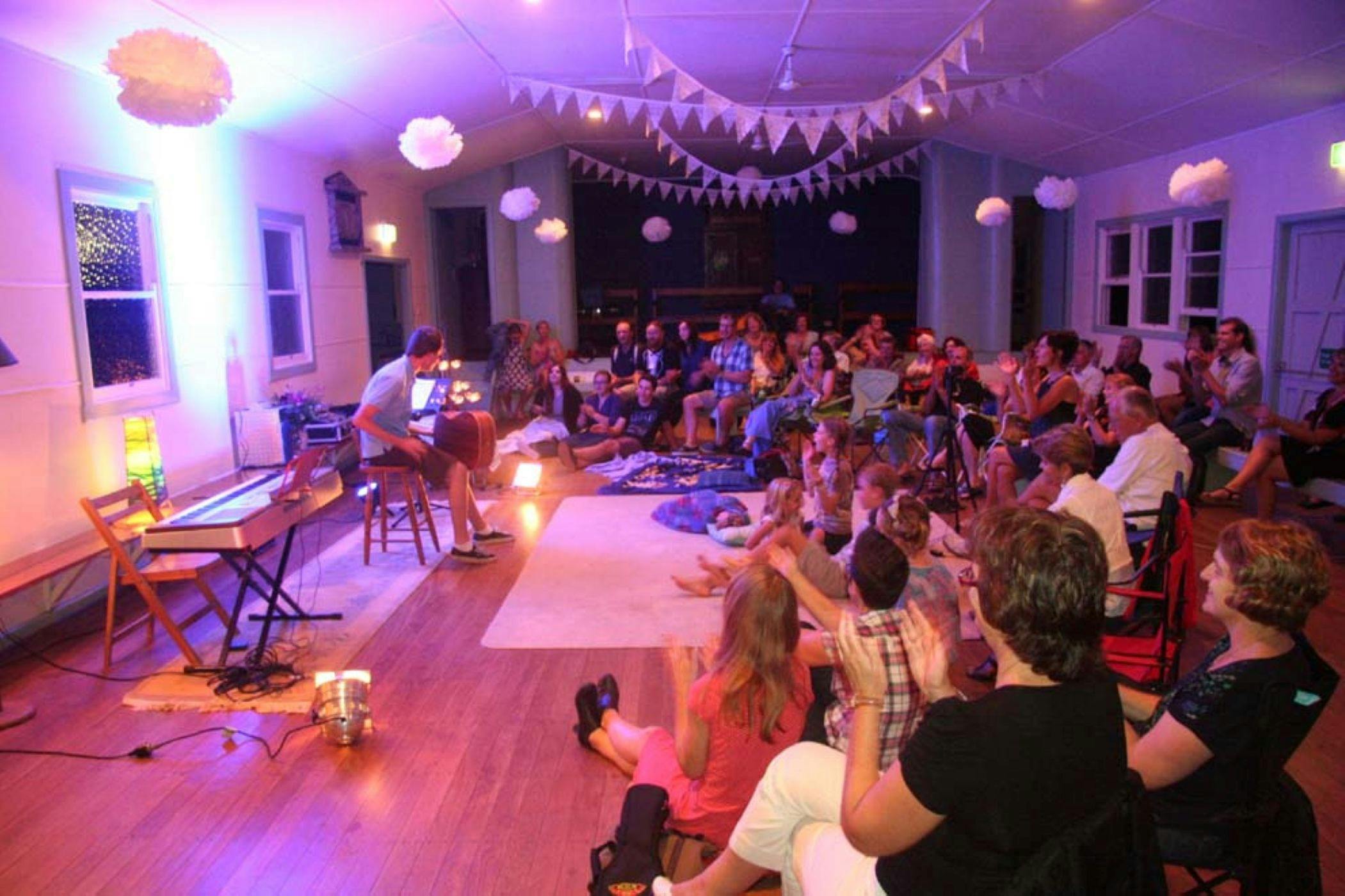 Rous Unplugged at Rous Mill Hall people playing guitar and singing