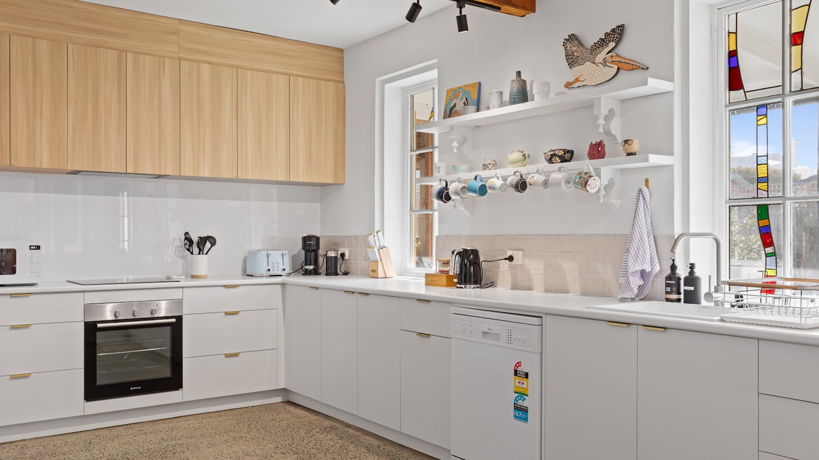 Fully equipped kitchen with dishwasher, fridge/freezer, stove/oven, microwave, and Nespresso