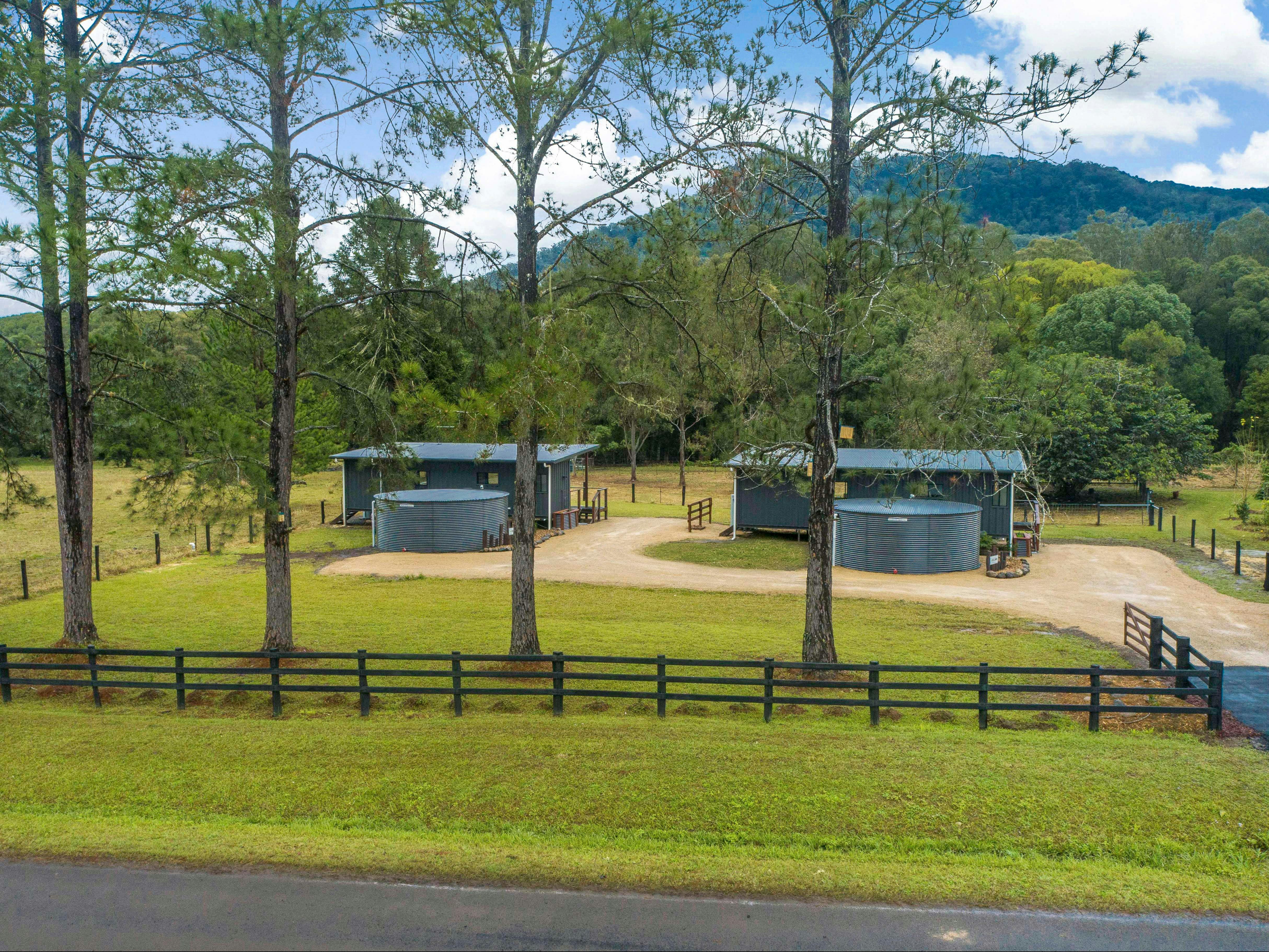 View of property from the roadway. In shot are both cottages as they sit on the land