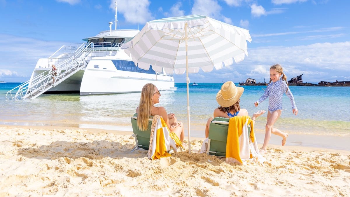 A scenic view of Moreton Island's white sandy beaches and clear turquoise waters