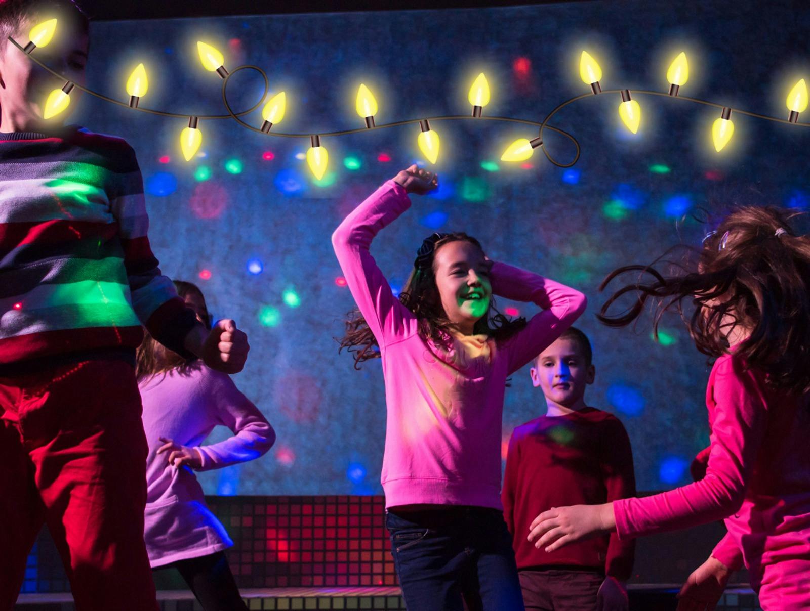 Children dancing under neon lights
