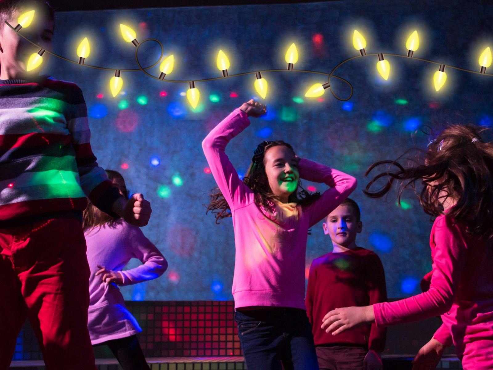 Children dancing under neon lights