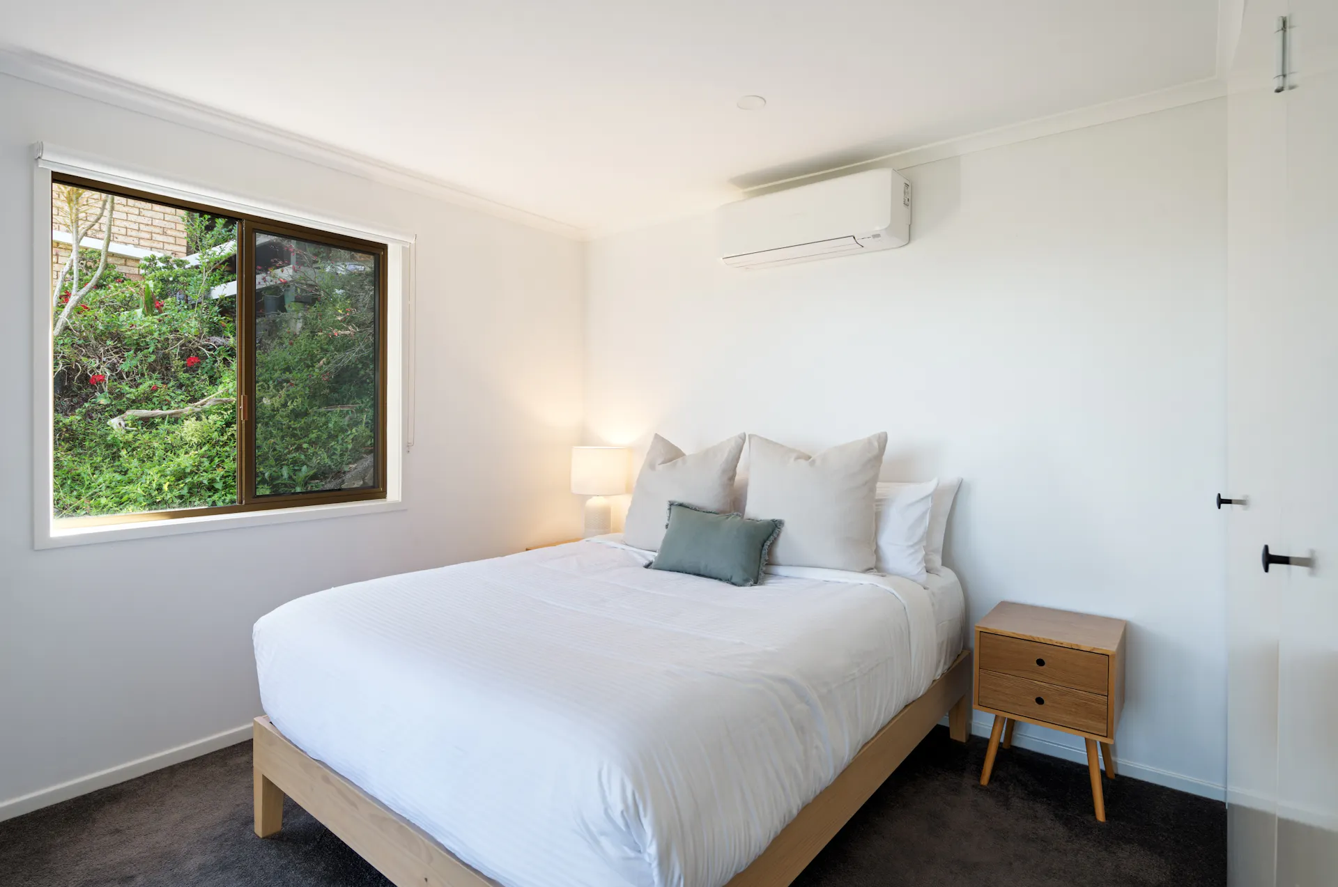 Wake up to picturesque views of lush trees right outside your bedroom windows
