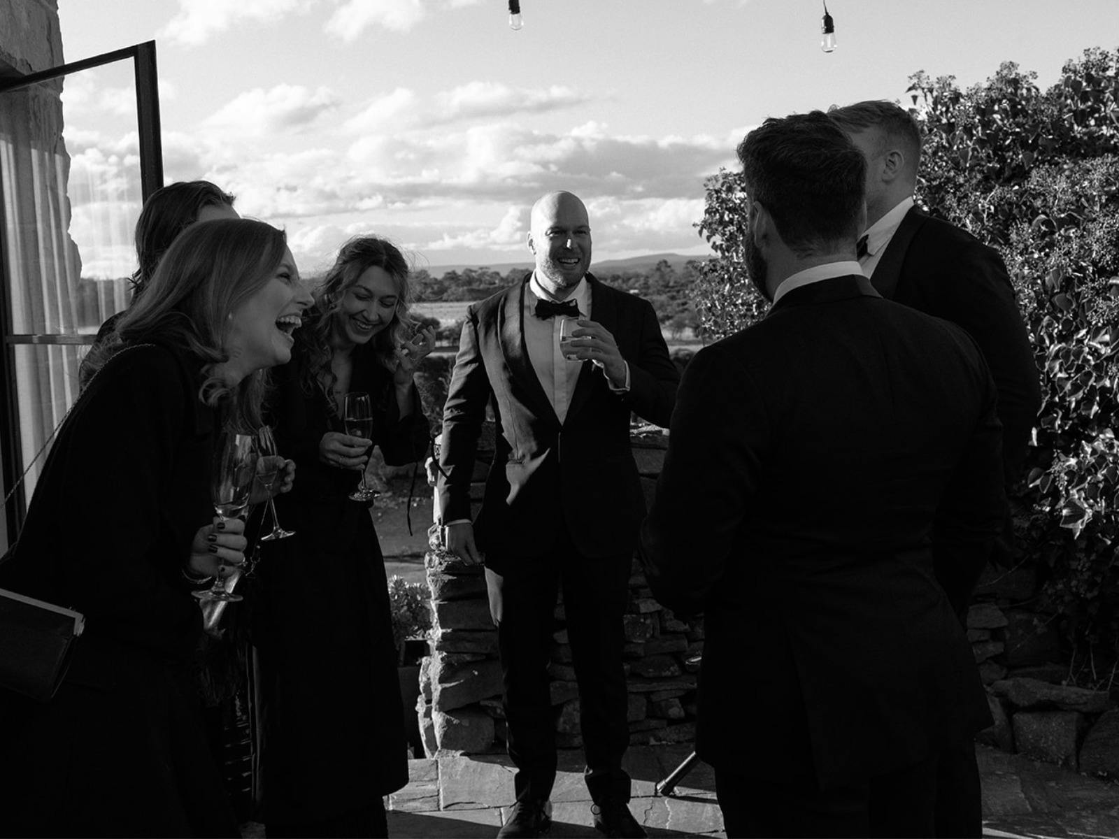 Guests at an event laughing