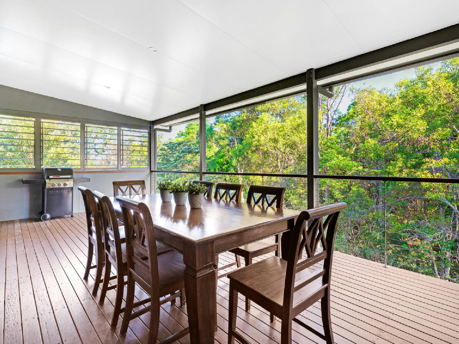 Balcony with BBQ and outdoor dining