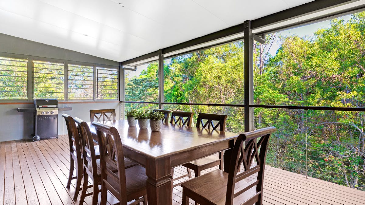 Balcony with BBQ and outdoor dining