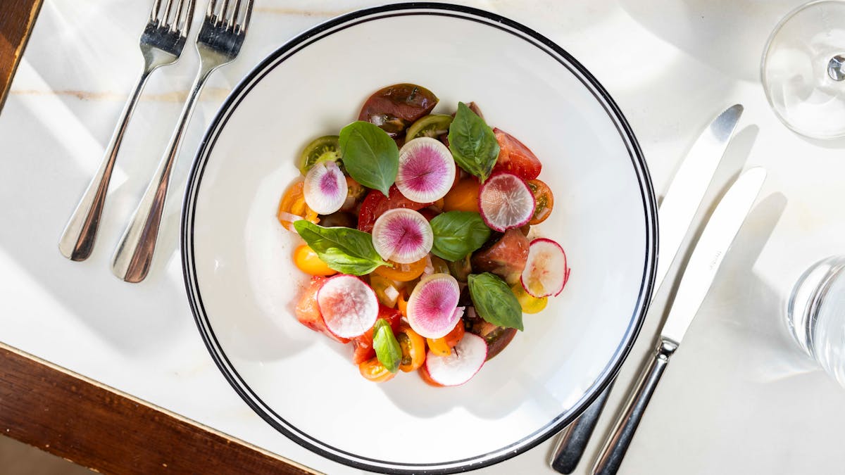 Tomato salad, radish, rocket, basil, shallots