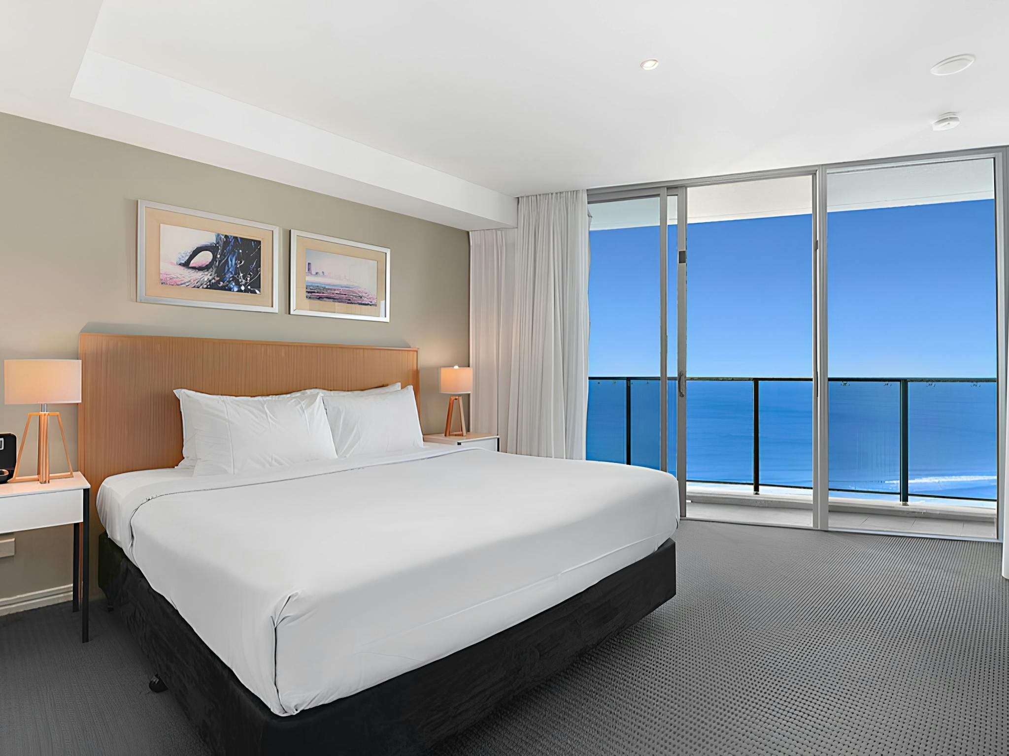 Master bedroom with King bed, private balcony access and ocean views - Hilton Residences Master bedroom with King bed, private balcony access and ocean views - Hilton Residences