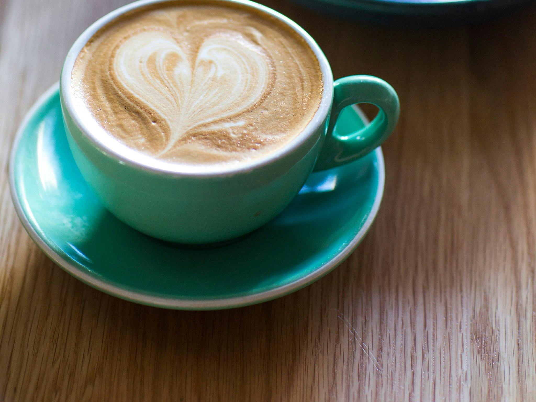 Cup of coffee with a love heart on top
