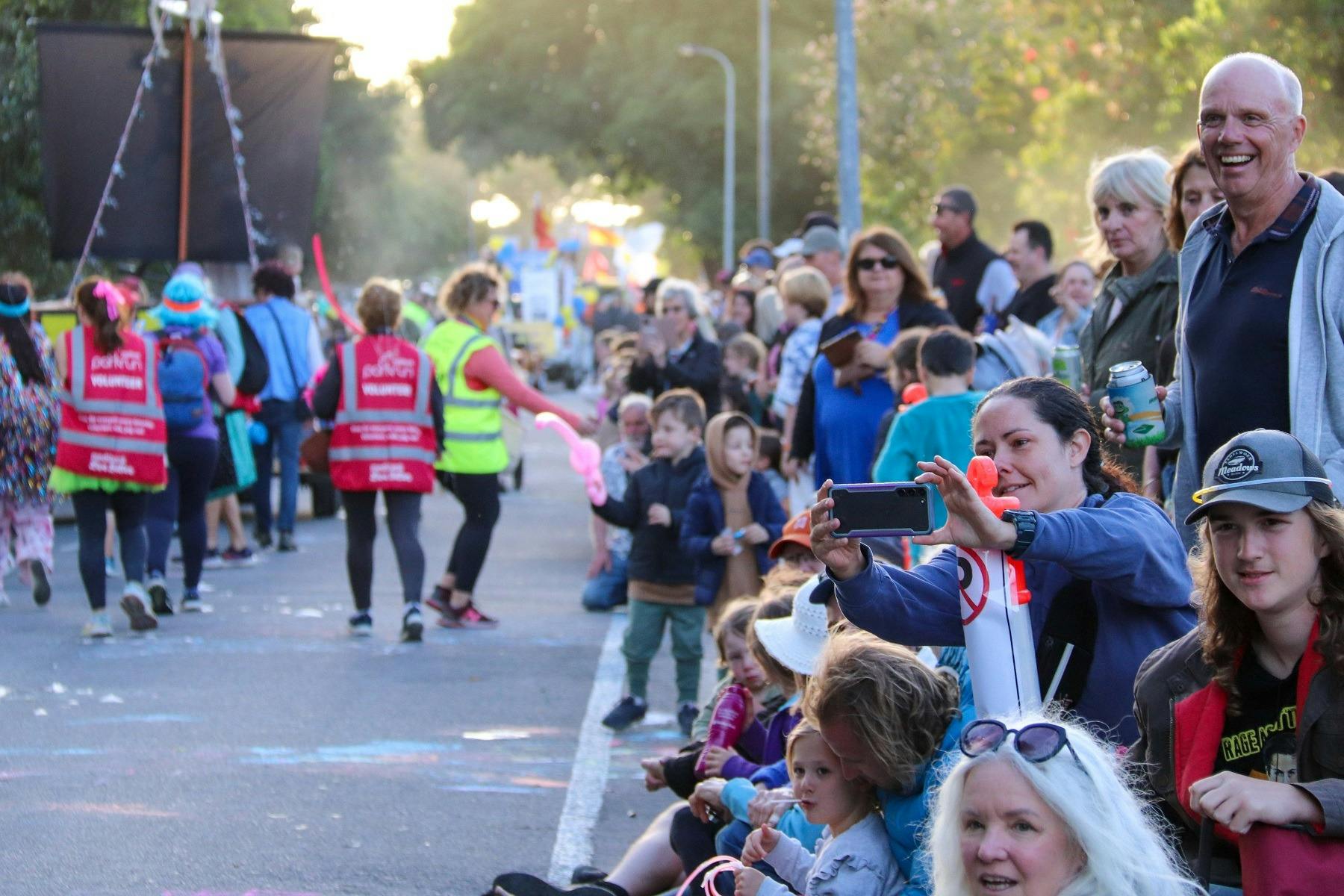 Crowd enjoying the parade of floats moving toward the Normanville Foreshore.