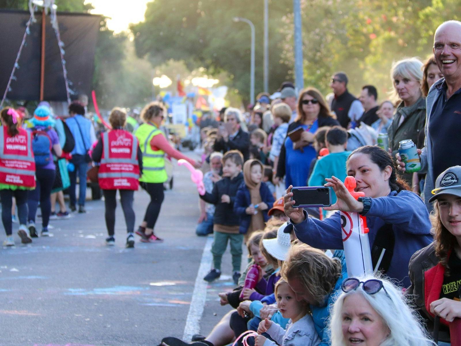 Crowd enjoying the parade of floats moving toward the Normanville Foreshore.